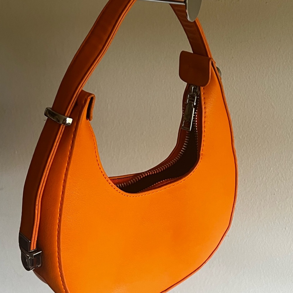 small orange circle bag